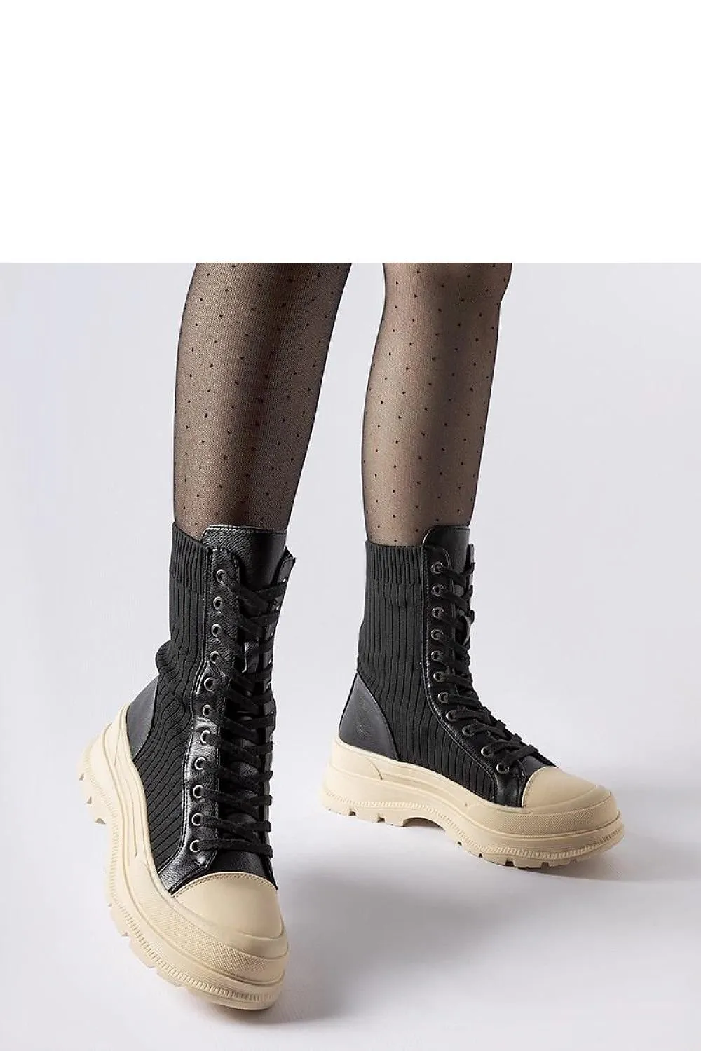 Black sock boots with a light sole