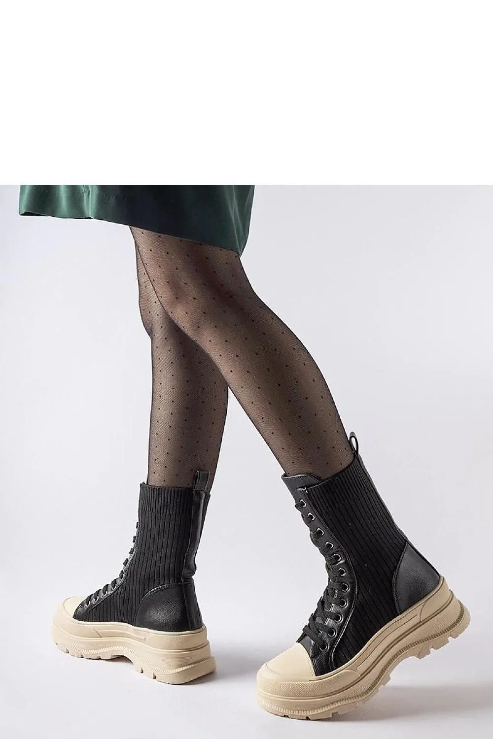 Black sock boots with a light sole